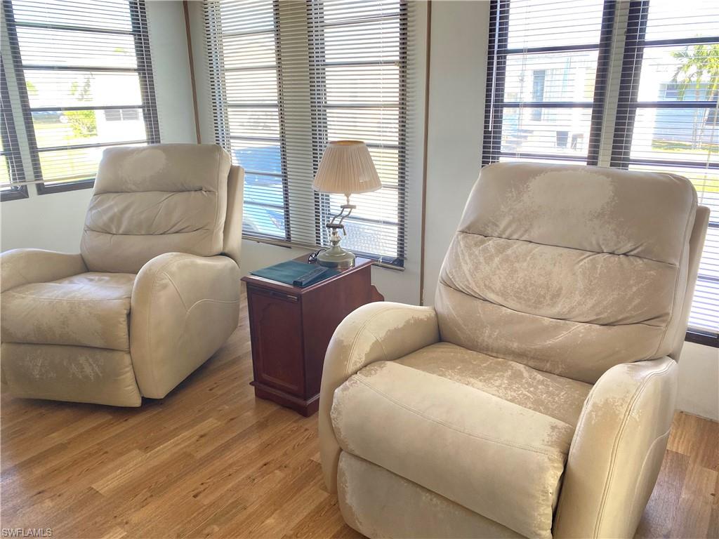 4561 Split Log Lane East Estero, FL 33928 - Photo 4 of 8 a living room with furniture and a large window
