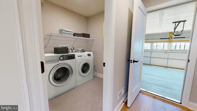 a view of a storage & utility room with washer and dryer
