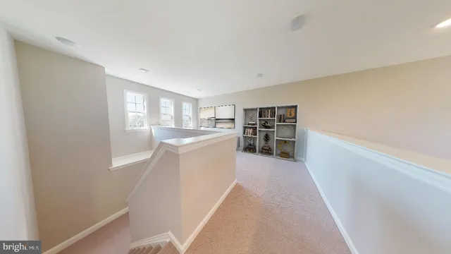 a view of a kitchen with furniture and wooden floor