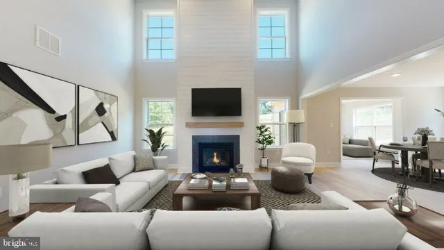a living room with furniture fireplace and a flat screen tv