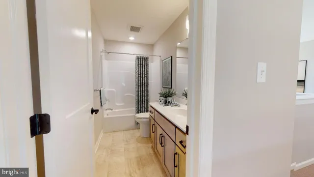 a bathroom with a shower and a sink