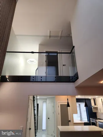 a kitchen with a cabinets and chandelier