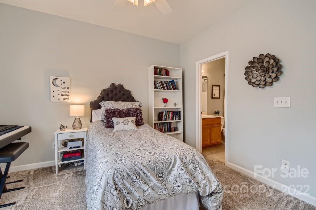 10461 Rocky Ford Club Road Charlotte, NC 28078 - Photo 20 of 27 a bedroom with a bed and a dresser