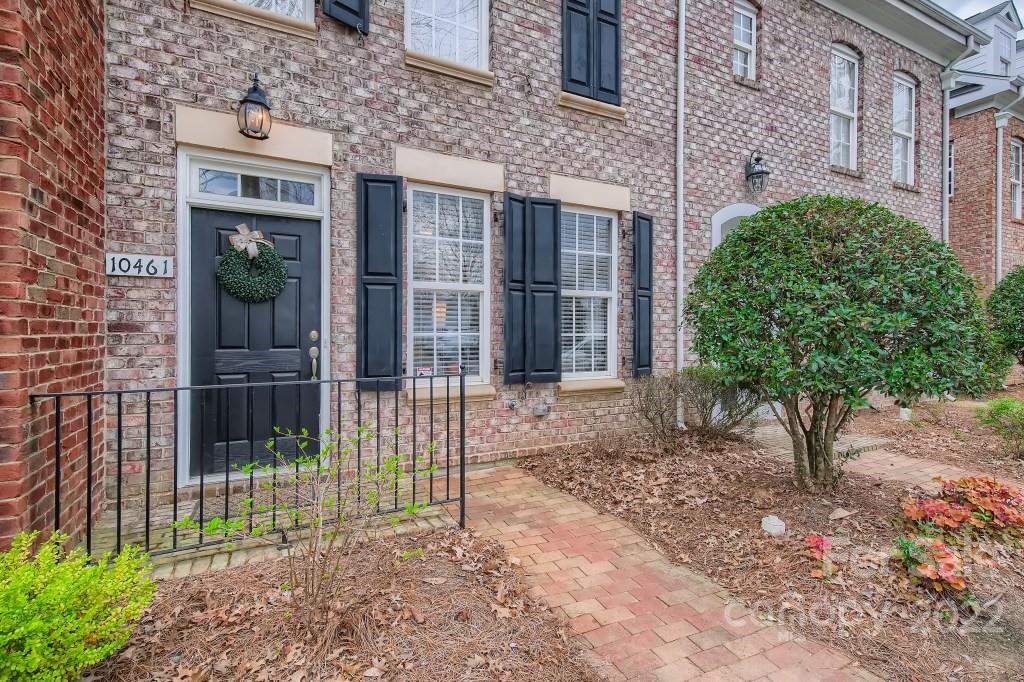 10461 Rocky Ford Club Road Charlotte, NC 28078 - Photo 2 of 27 a view of a house with a small yard and plants