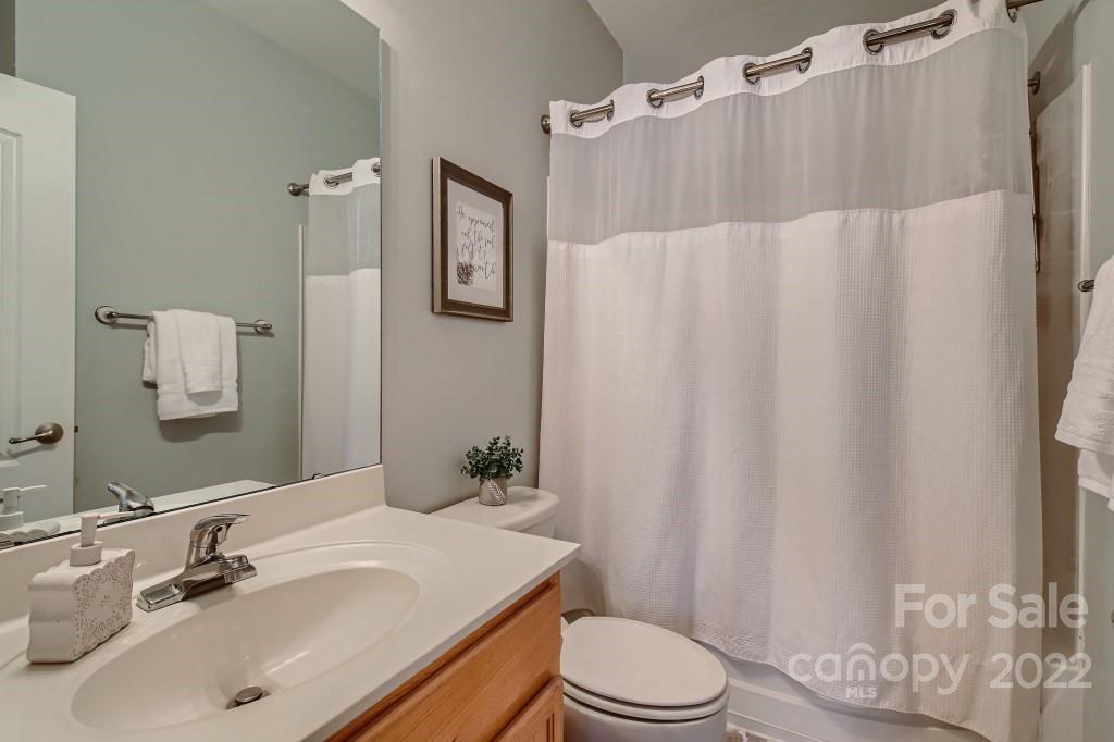 10461 Rocky Ford Club Road Charlotte, NC 28078 - Photo 21 of 27 a bathroom with a sink toilet and shower