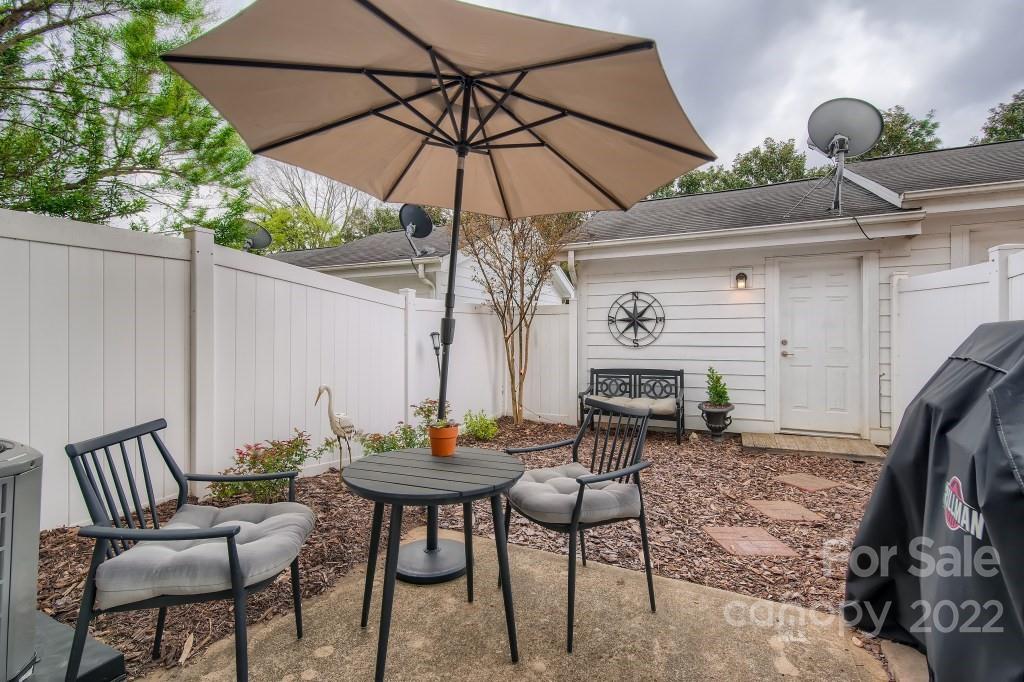 10461 Rocky Ford Club Road Charlotte, NC 28078 - Photo 24 of 27 a view of patio with furniture and umbrella