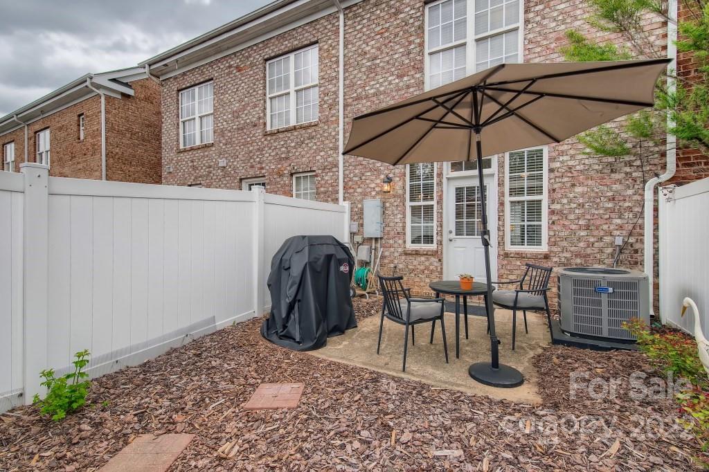 10461 Rocky Ford Club Road Charlotte, NC 28078 - Photo 26 of 27 a view of a chair and table in the patio
