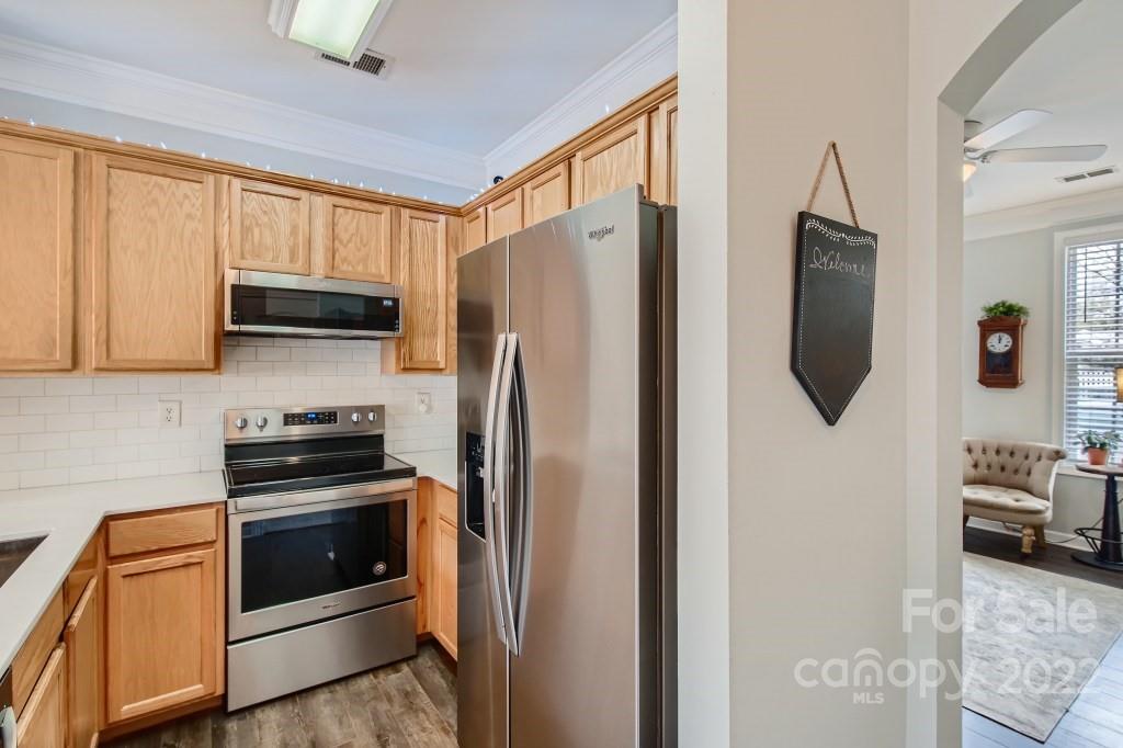 10461 Rocky Ford Club Road Charlotte, NC 28078 - Photo 10 of 27 a kitchen with stainless steel appliances a refrigerator stove and microwave