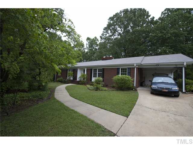 5010 Picardy Place Raleigh, NC 27612 - Photo 23 of 25 a car parked in front of a house and garden
