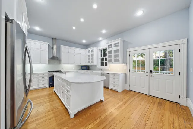 a kitchen with a sink stove and refrigerator