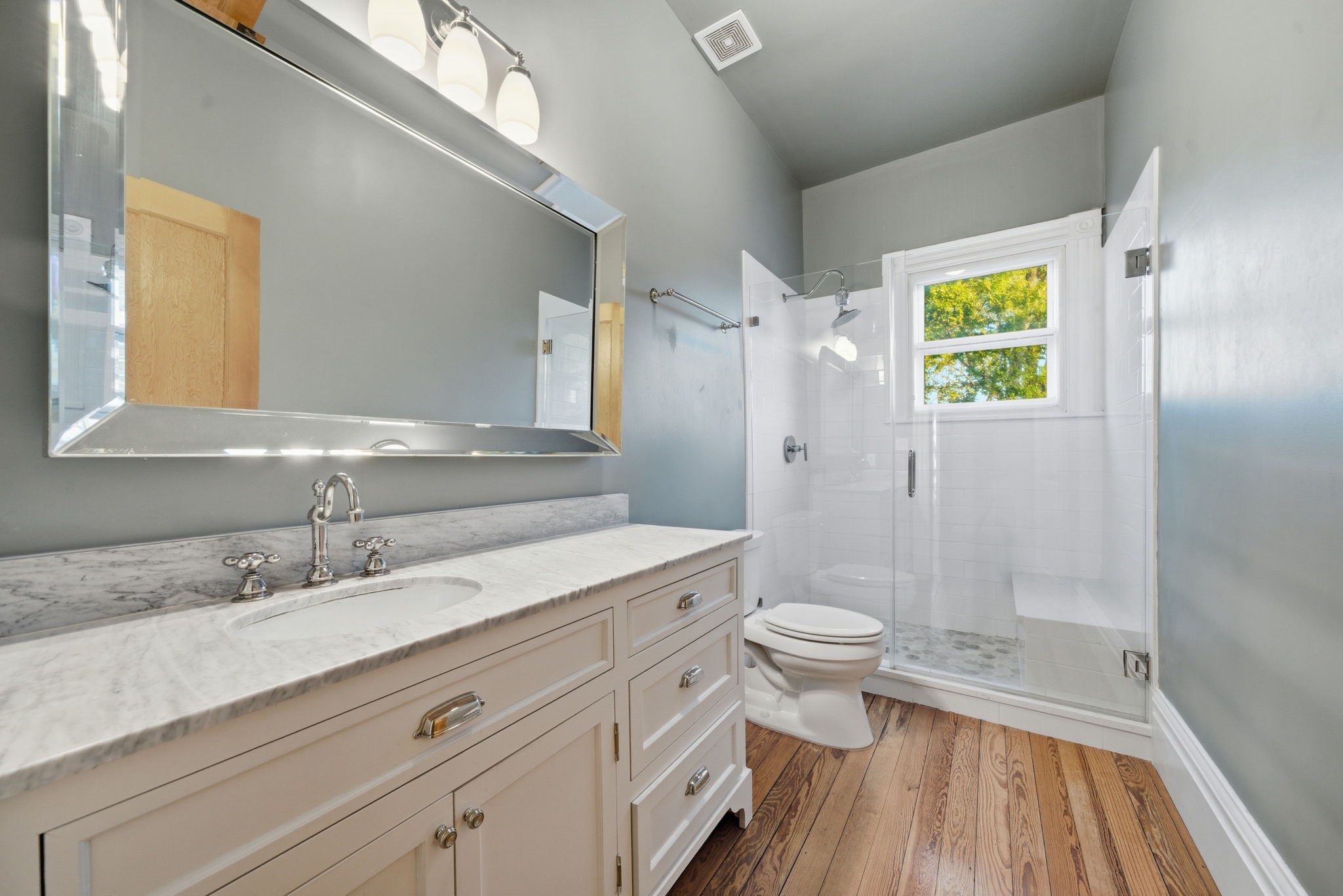 1818 Decatur Street Houston, TX 77007 - Photo 32 of 48 a bathroom with a double vanity sink toilet and shower