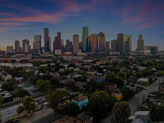 a view of a city with tall buildings
