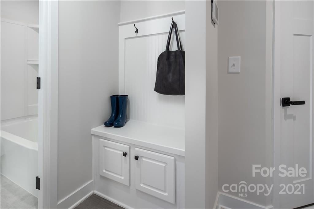 2007 Dornoch Road, Unit 1033B Tega Cay, SC 29708 - Photo 1 of 12 a bathroom with a sink and a mirror