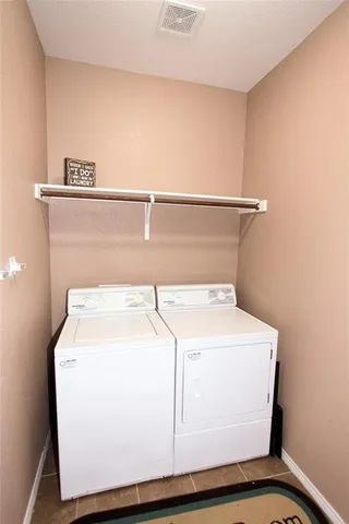 a living room with furniture flat screen tv and wooden floor