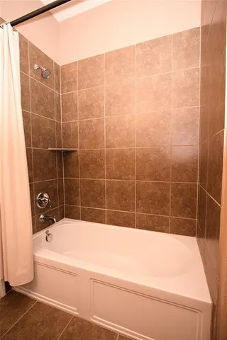 a view of a backyard with plants and entertaining space