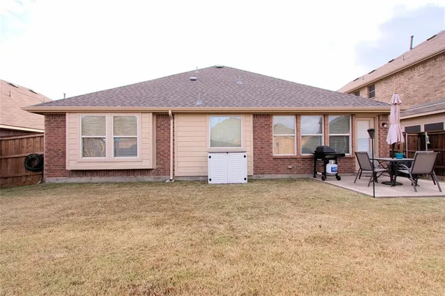 a view of a house with table and chairs