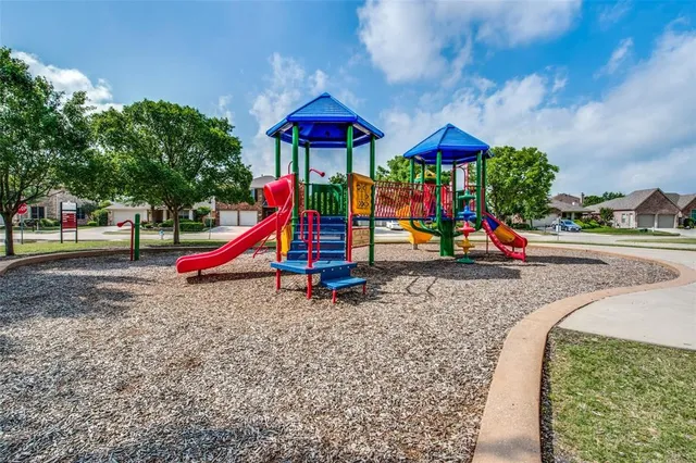 a view of a swimming pool with a yard