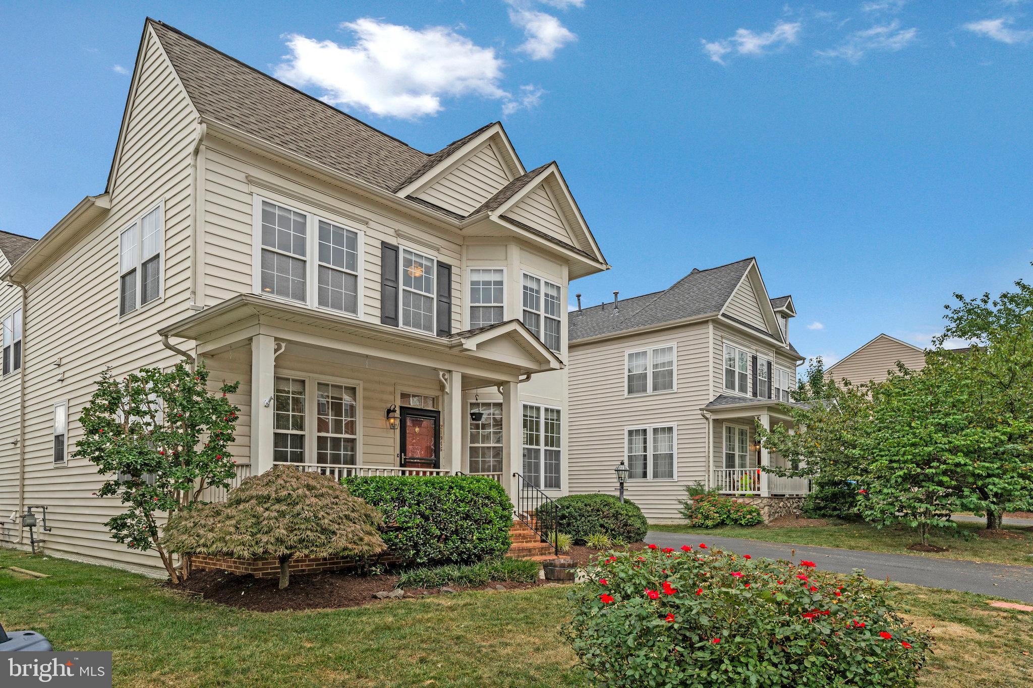 21946 Windover Drive Broadlands, VA 20148 - Photo 2 of 45 front view of a house with a yard