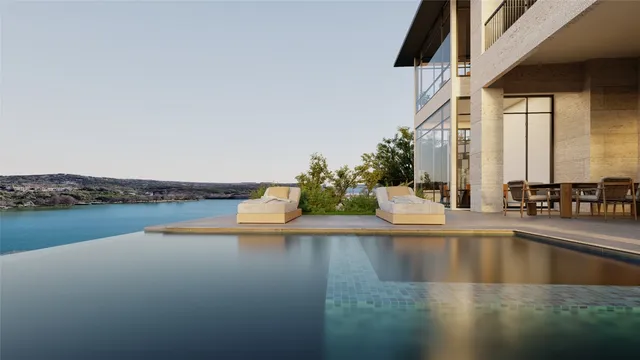 a view of a swimming pool with an outdoor seating