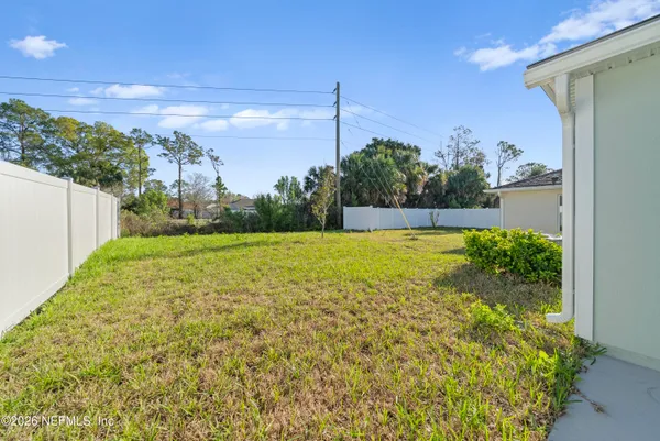 a view of a back yard of the house