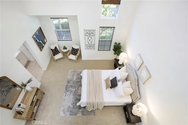 a view of a workspace with furniture and wooden floor
