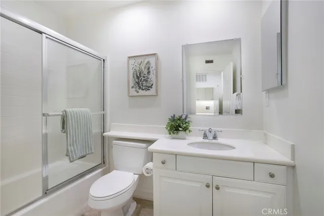 a bathroom with a bathtub and a toilet