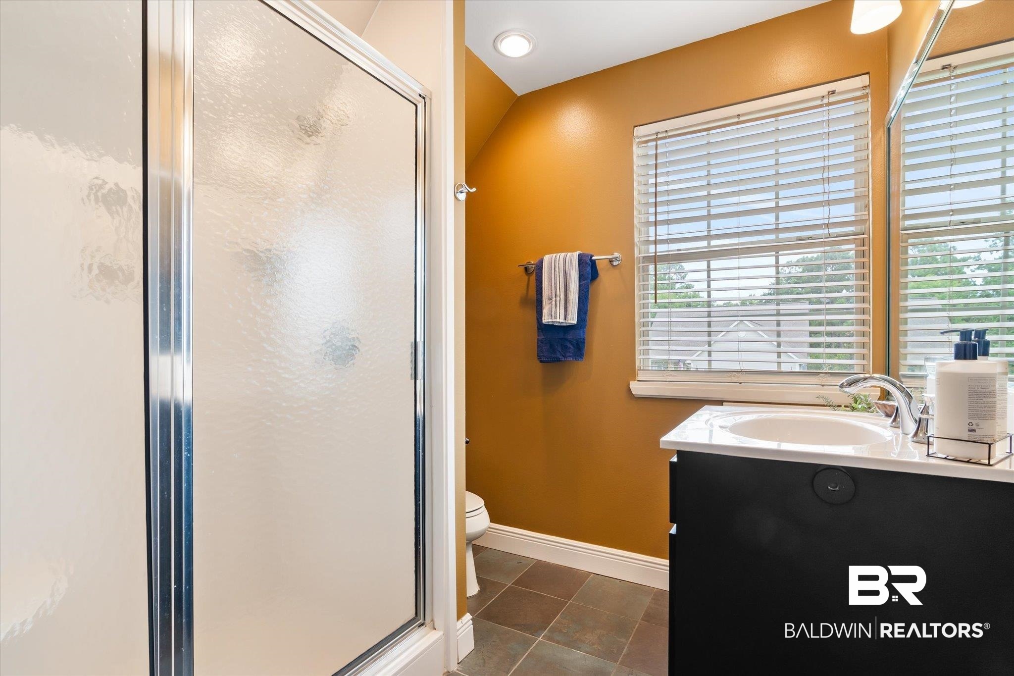 30648 Pine Court Daphne, AL 36527 - Photo 20 of 30 Bathroom with vanity, walk in shower, tile patterned flooring, and toilet