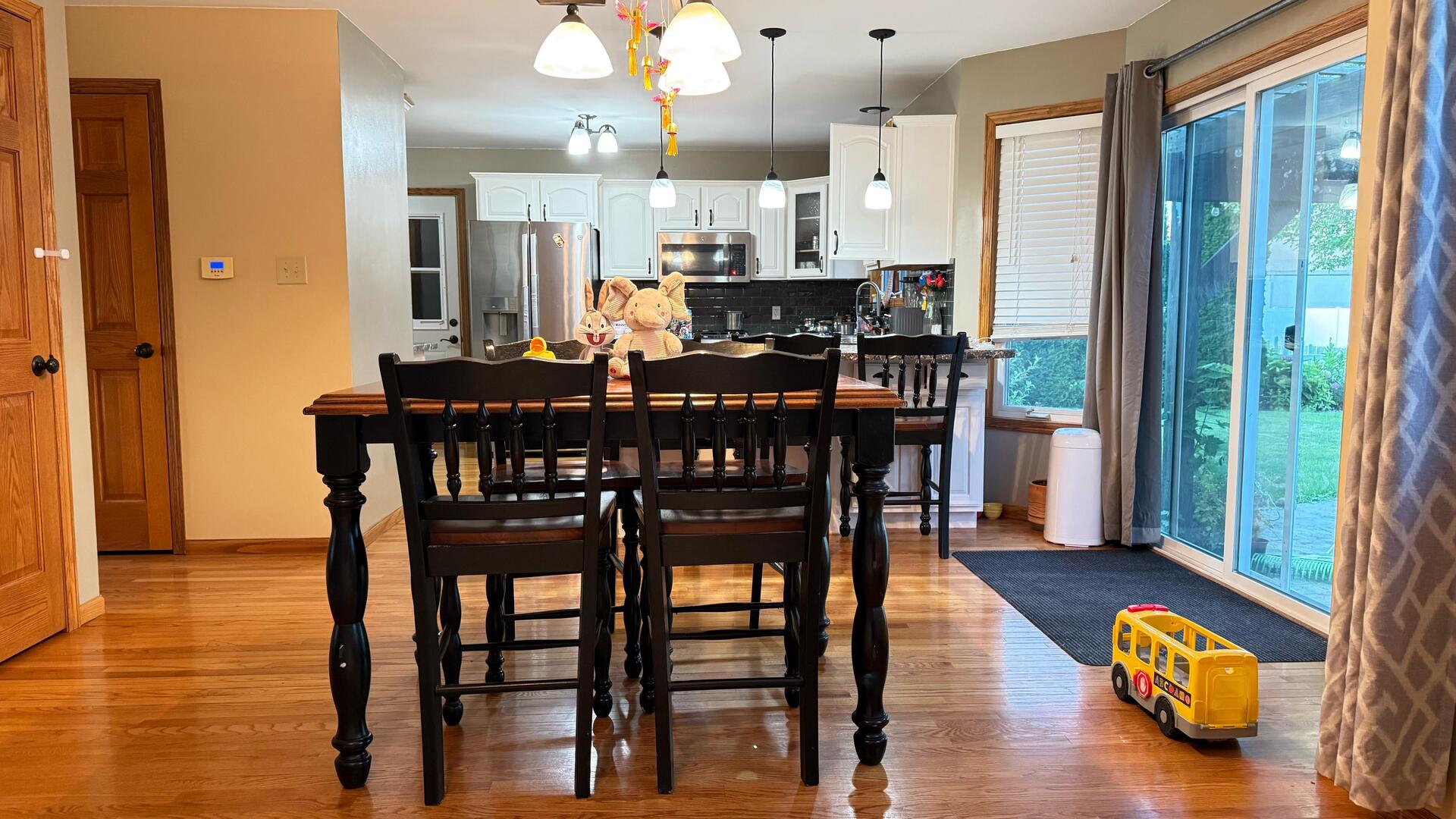 4 Memory Lane Streator, IL 61364 - Photo 11 of 28 a view of a dining room with furniture and wooden floor