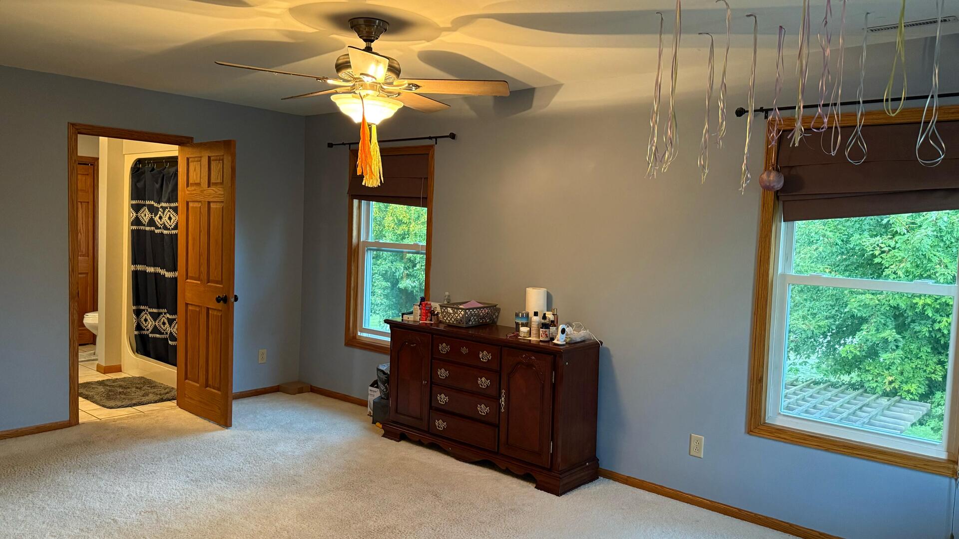 4 Memory Lane Streator, IL 61364 - Photo 13 of 28 a bedroom with a bed and a chandelier