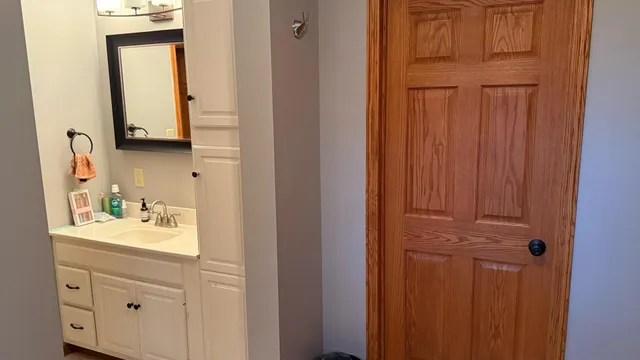 a view of hallway with wooden floor