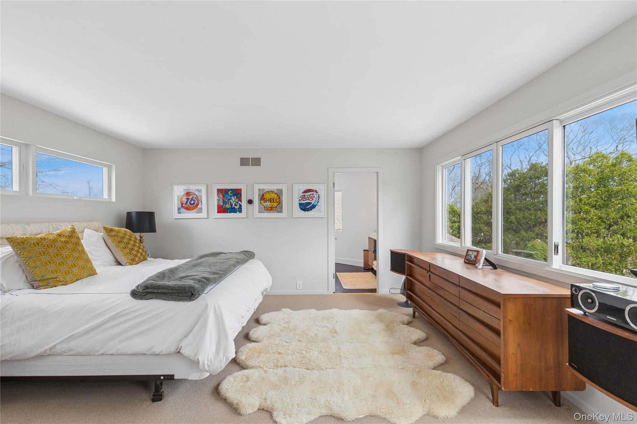 2 Acorn Path Quogue, NY 11959 - Photo 6 of 16 Bright Primary bedroom with balcony and ensuite bathroom