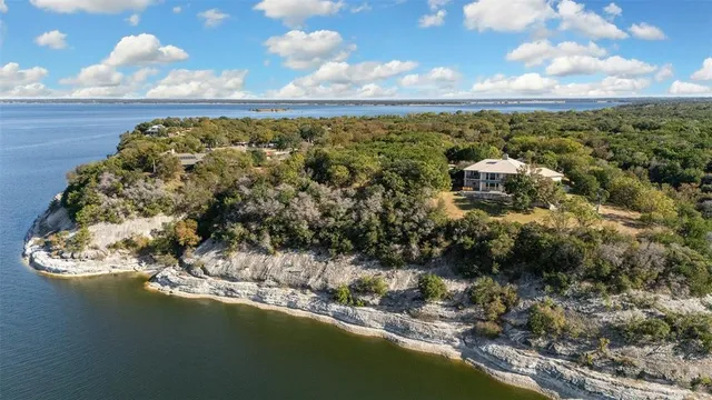a view of a lake in middle of forest