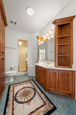 a room with sink and mirror