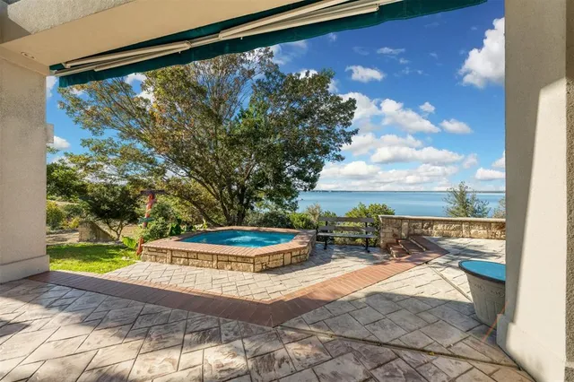 a view of a balcony with chair and table