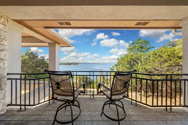 a view of balcony with furniture