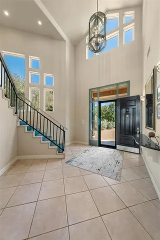 a view of an entryway with a chandelier