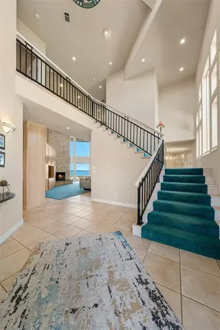 a view of entryway and hall with a front door