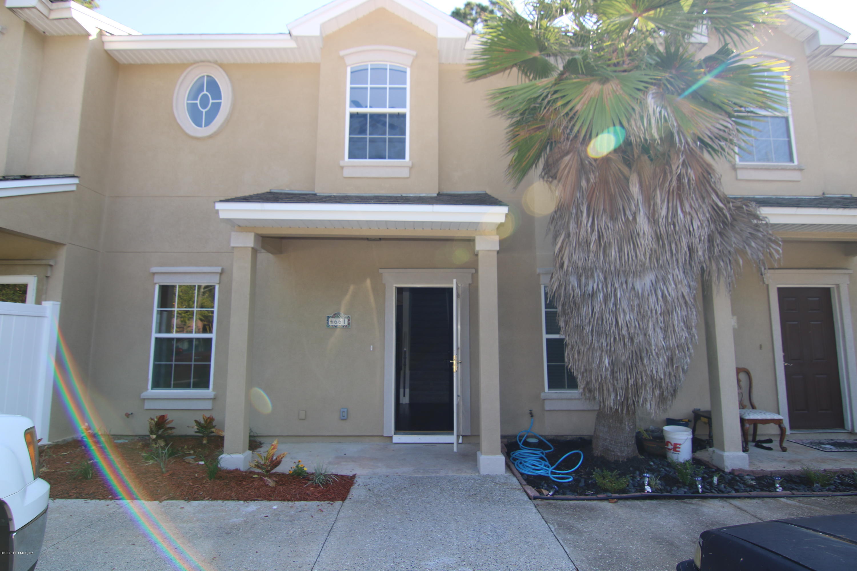4661 Barnes Road South Jacksonville, FL 32207 - Photo 1 of 22 a front view of a house with parking