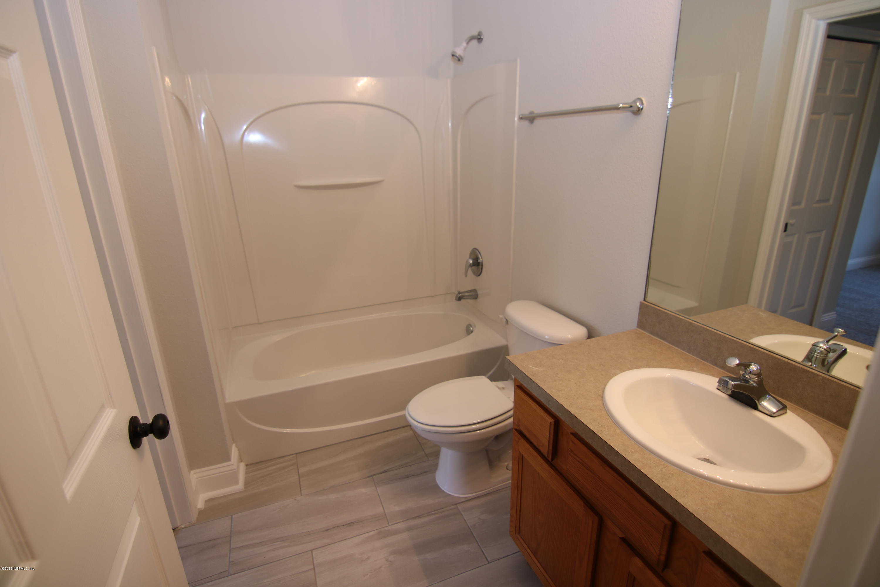 4661 Barnes Road South Jacksonville, FL 32207 - Photo 11 of 22 a bathroom with a sink toilet tub and shower