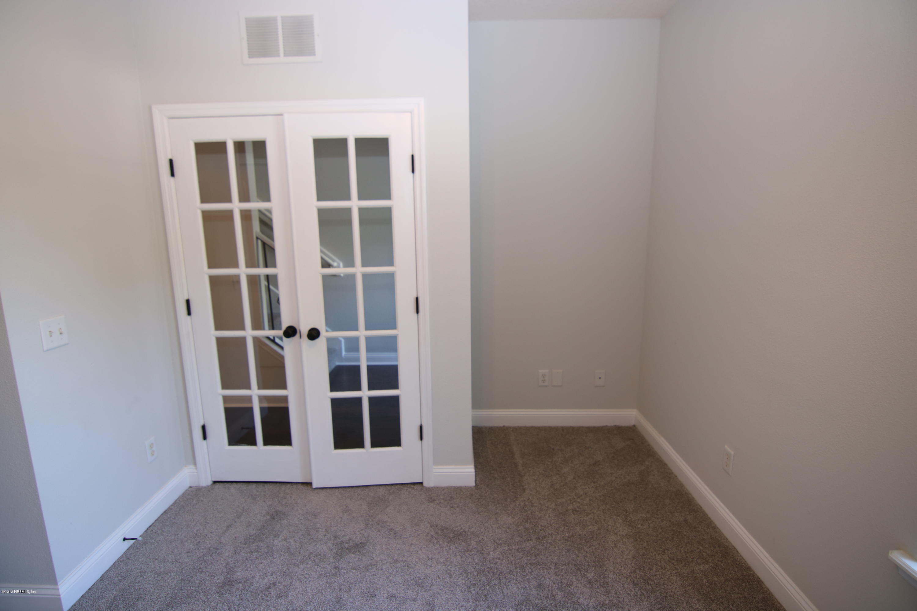 4661 Barnes Road South Jacksonville, FL 32207 - Photo 12 of 22 an empty room with windows