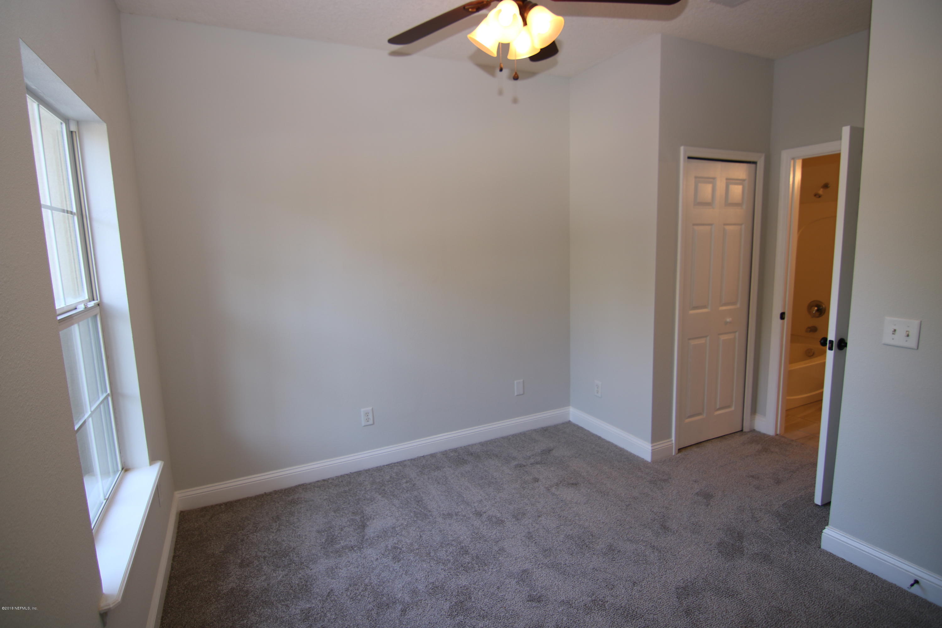 4661 Barnes Road South Jacksonville, FL 32207 - Photo 13 of 22 a view of an empty room and a window