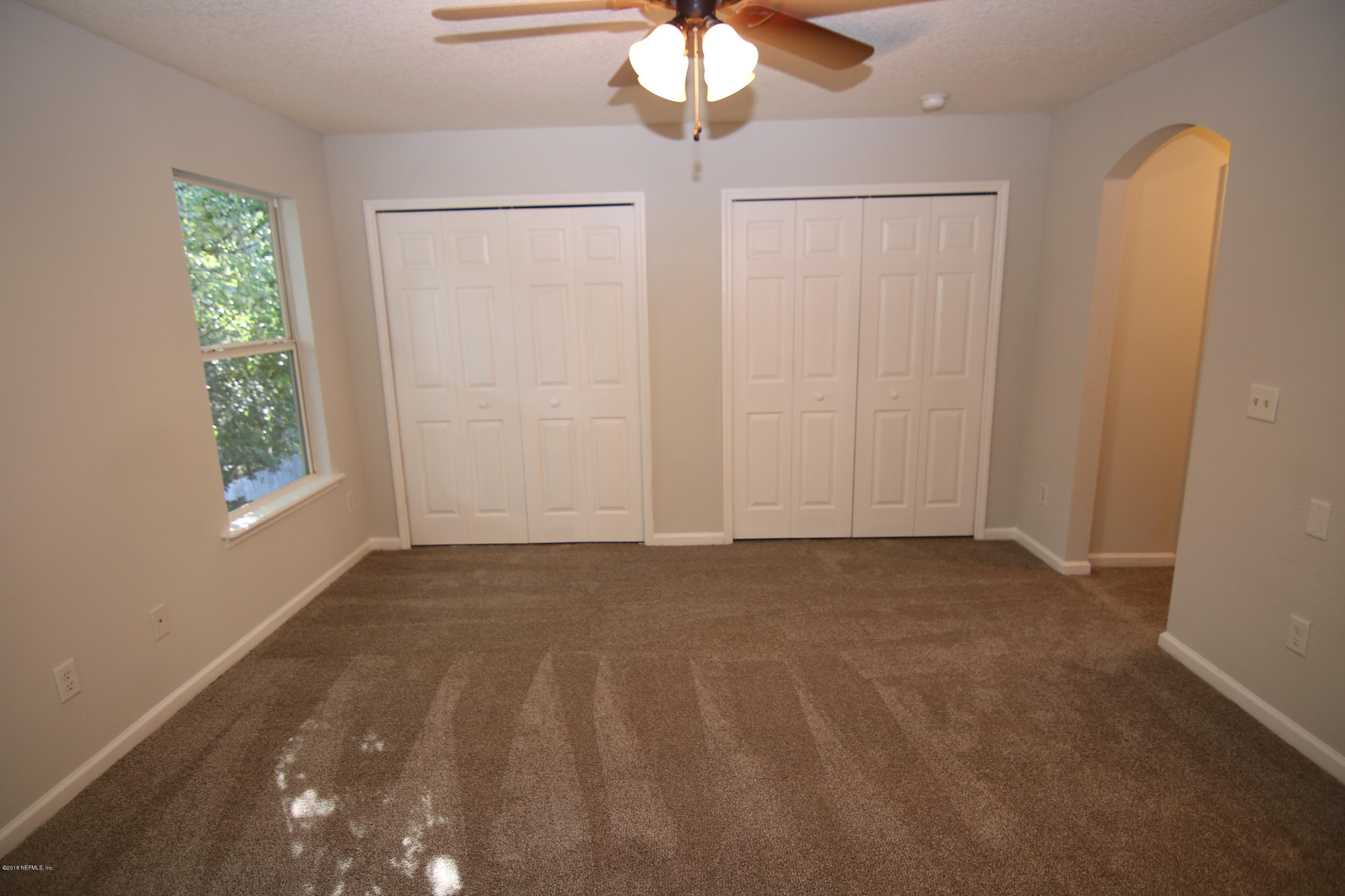 4661 Barnes Road South Jacksonville, FL 32207 - Photo 19 of 22 a view of an empty room with a window