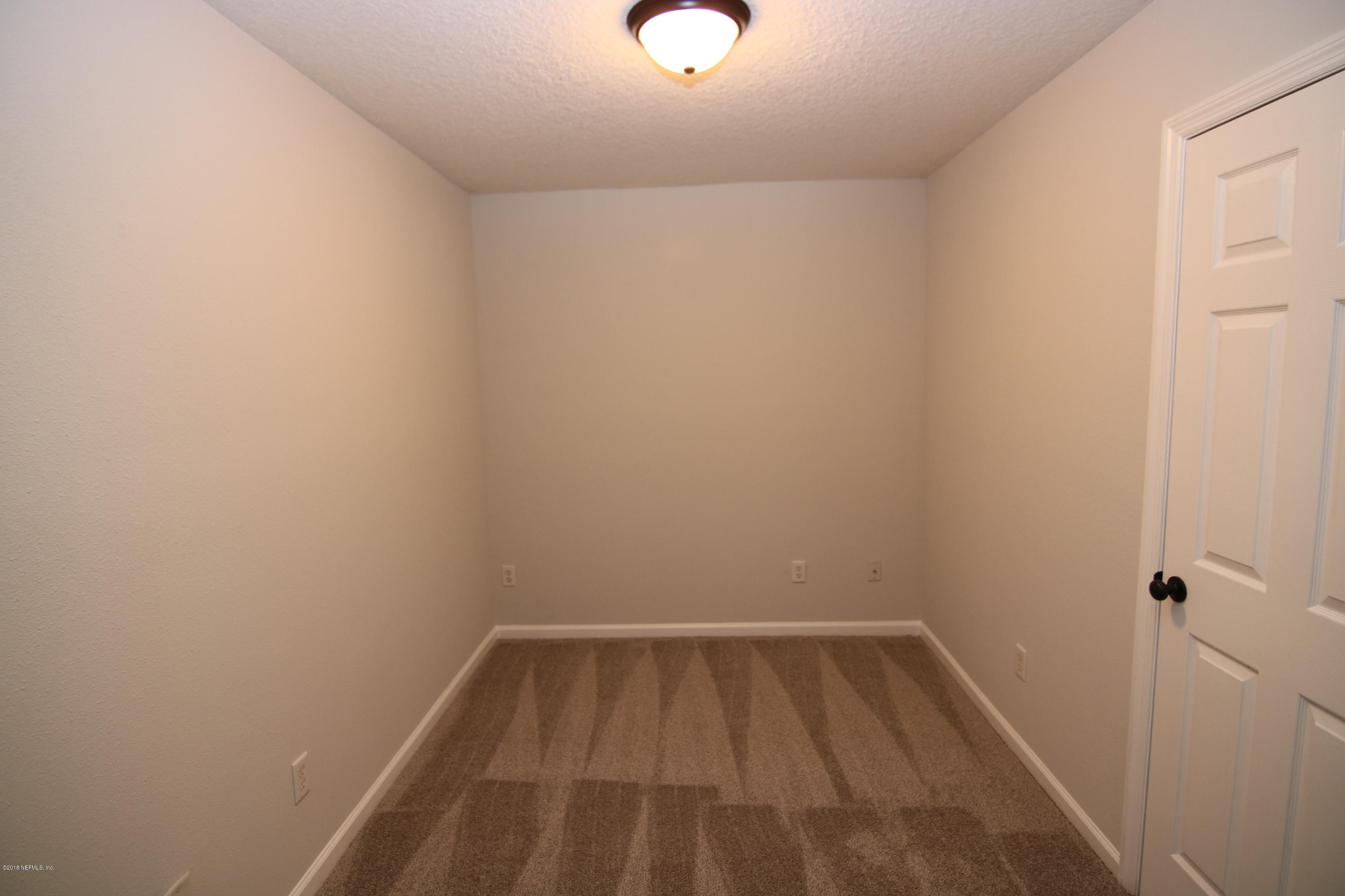 4661 Barnes Road South Jacksonville, FL 32207 - Photo 20 of 22 a view of a room with wooden floor