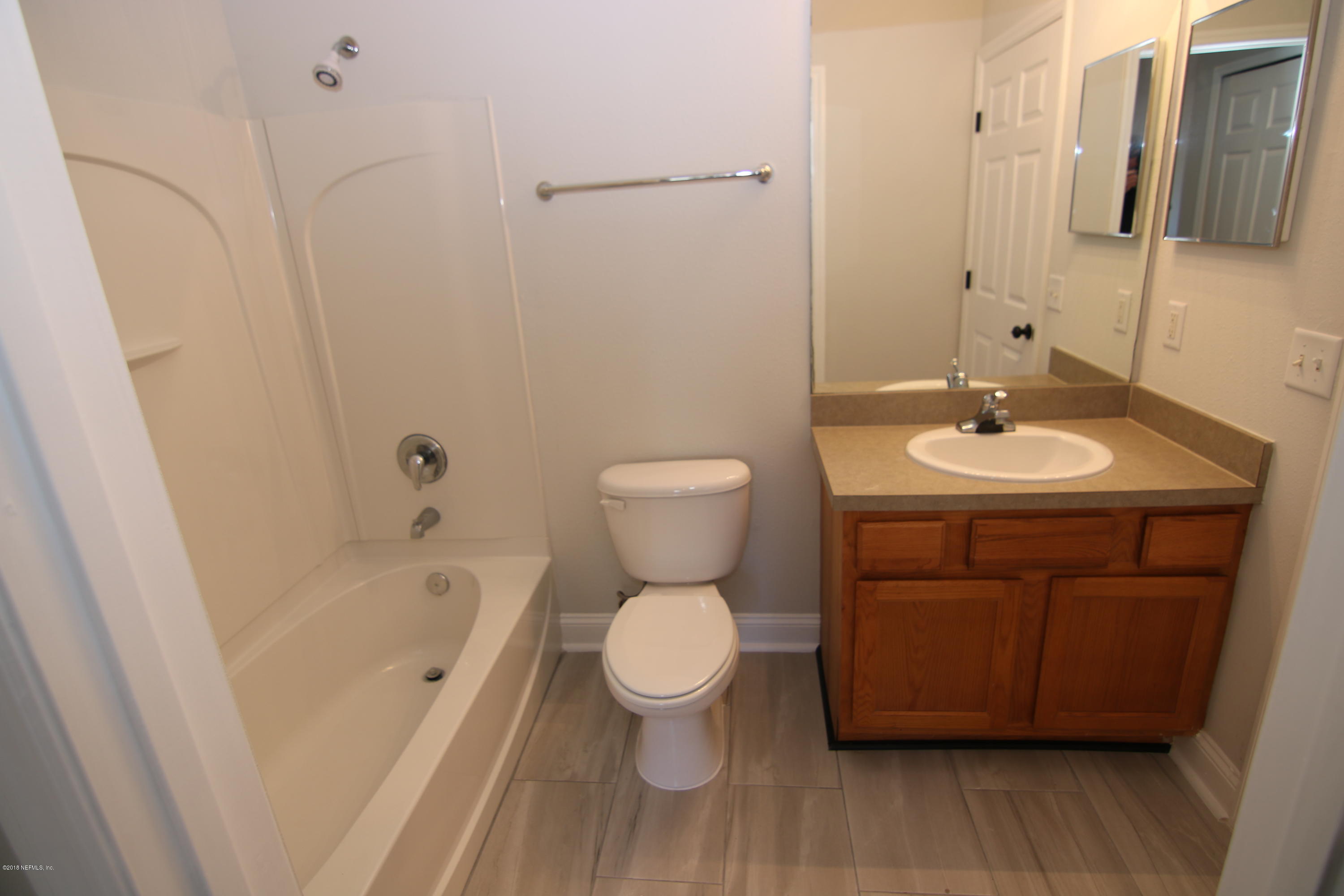 4661 Barnes Road South Jacksonville, FL 32207 - Photo 21 of 22 a bathroom with a sink a toilet and shower