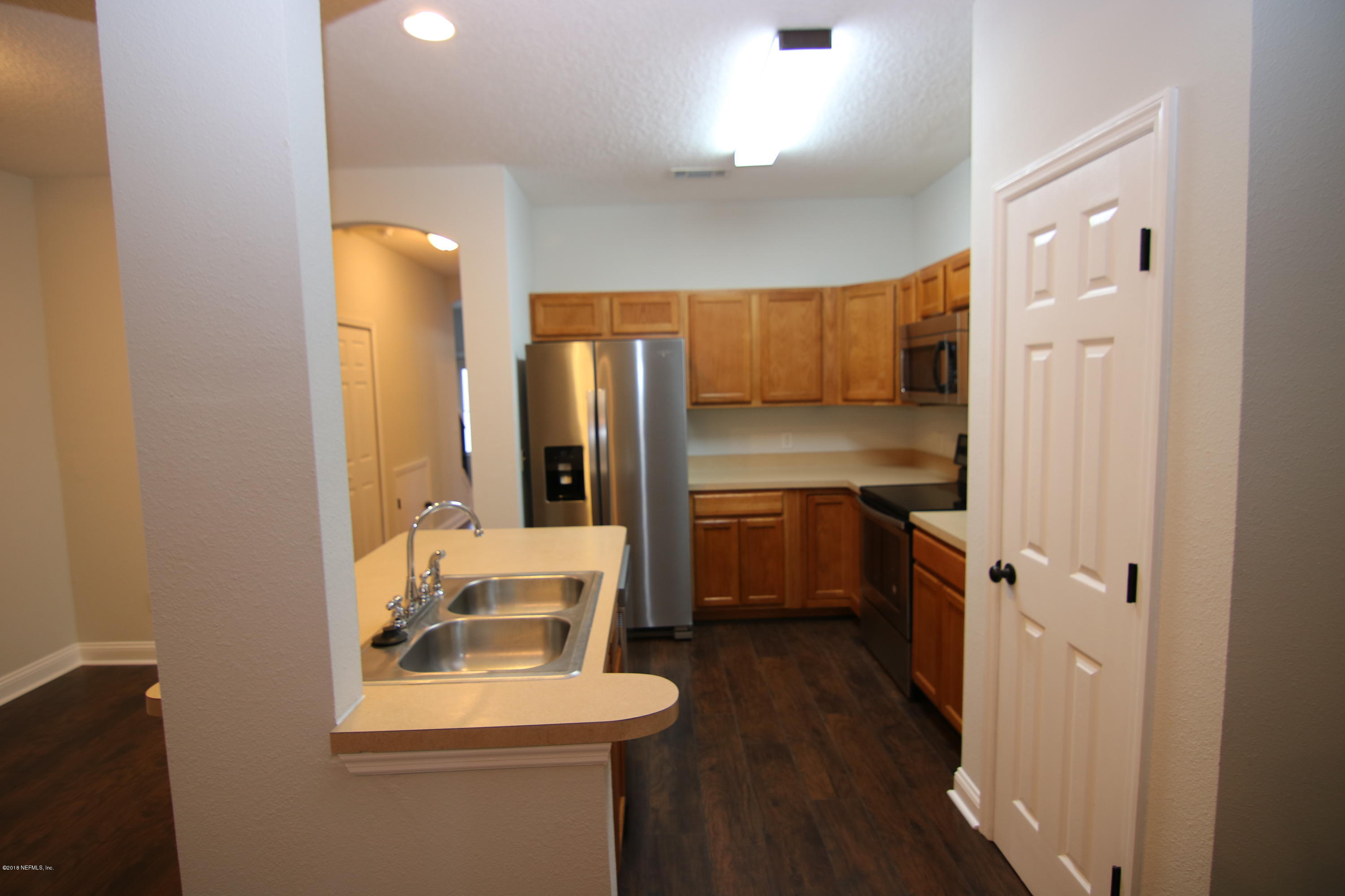 4661 Barnes Road South Jacksonville, FL 32207 - Photo 5 of 22 a bathroom with a sink toilet and shower