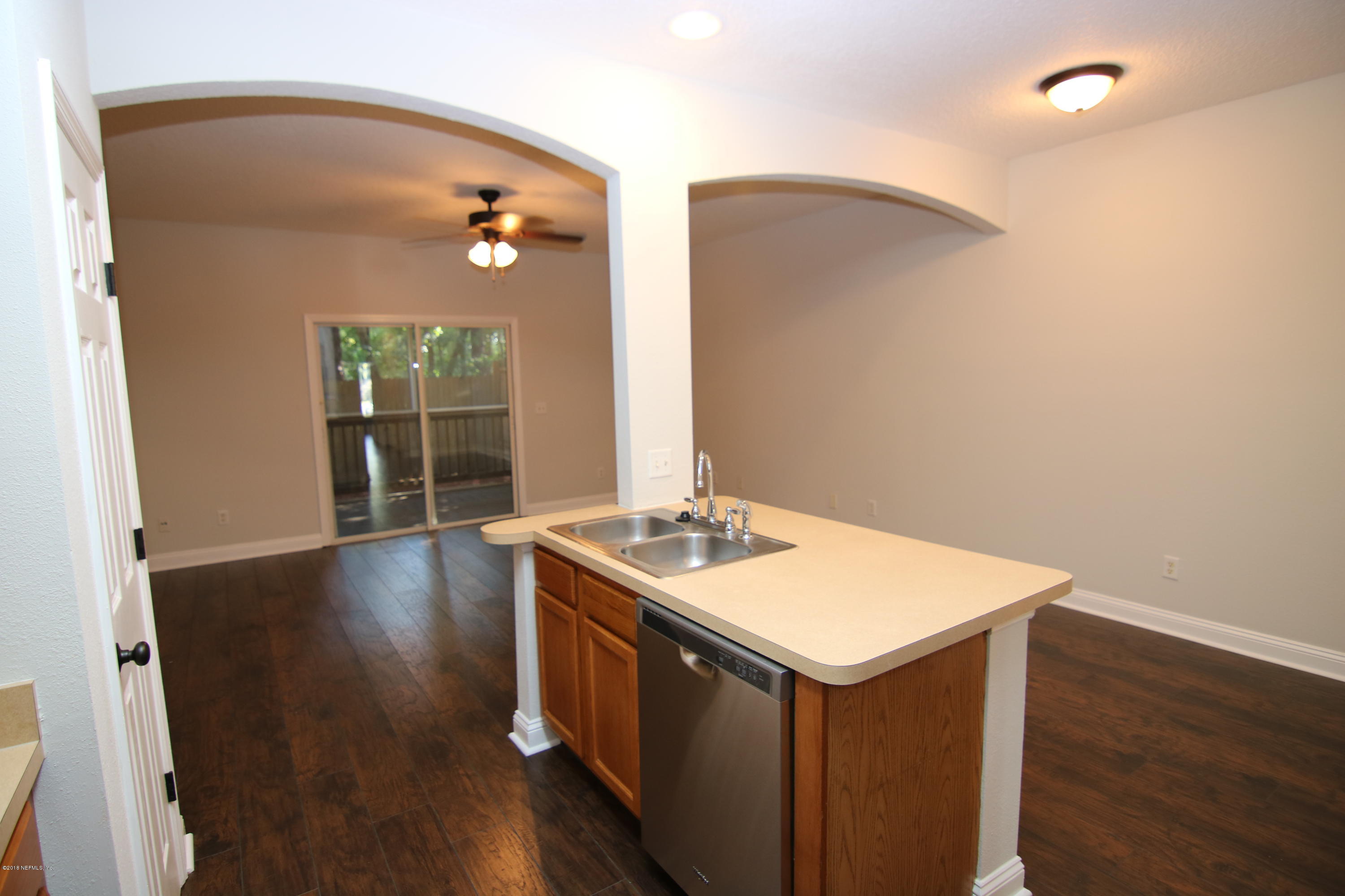 4661 Barnes Road South Jacksonville, FL 32207 - Photo 10 of 22 a kitchen with a sink and wooden floor