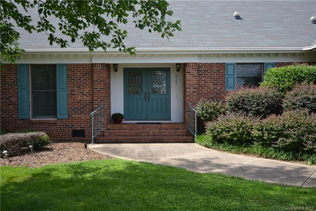 8147 Fairfield Forest Road Denver, NC 28037 - Photo 1 of 23 a front view of a house with garden