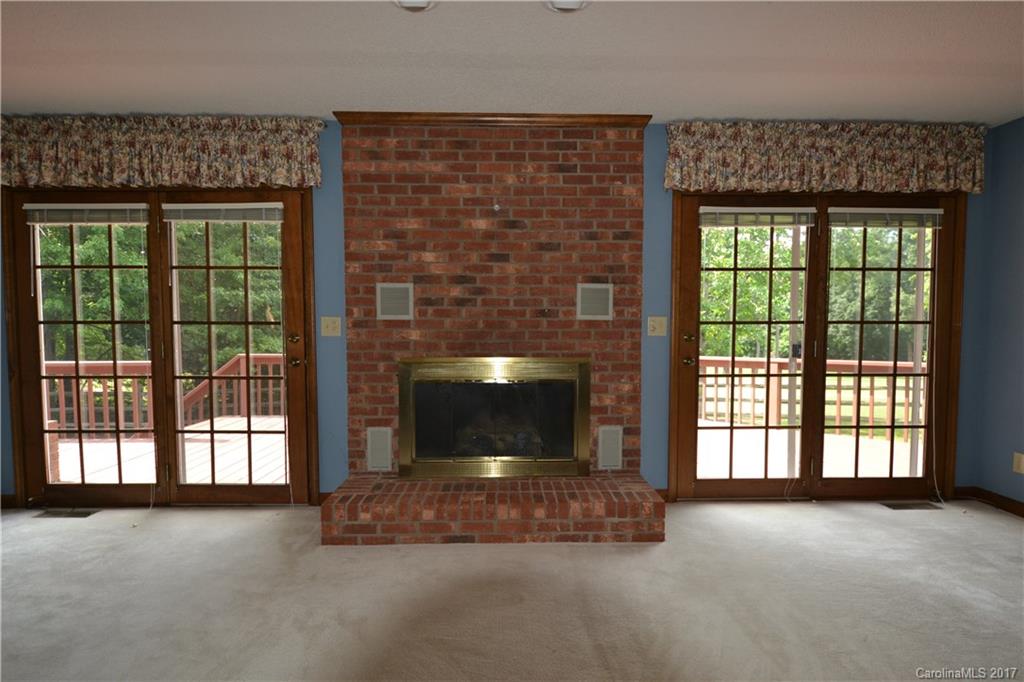 8147 Fairfield Forest Road Denver, NC 28037 - Photo 16 of 23 a living room with a fireplace