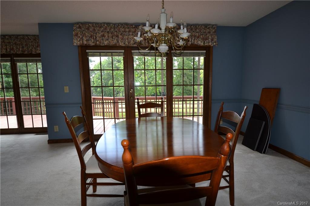8147 Fairfield Forest Road Denver, NC 28037 - Photo 17 of 23 a view of a dining room with furniture window and outside view