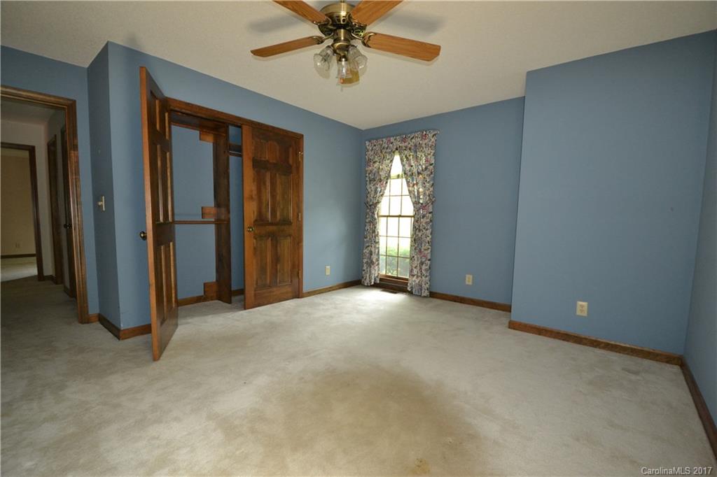 8147 Fairfield Forest Road Denver, NC 28037 - Photo 20 of 23 an empty room with windows and closet